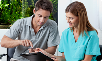 Dentist showing patient a tablet