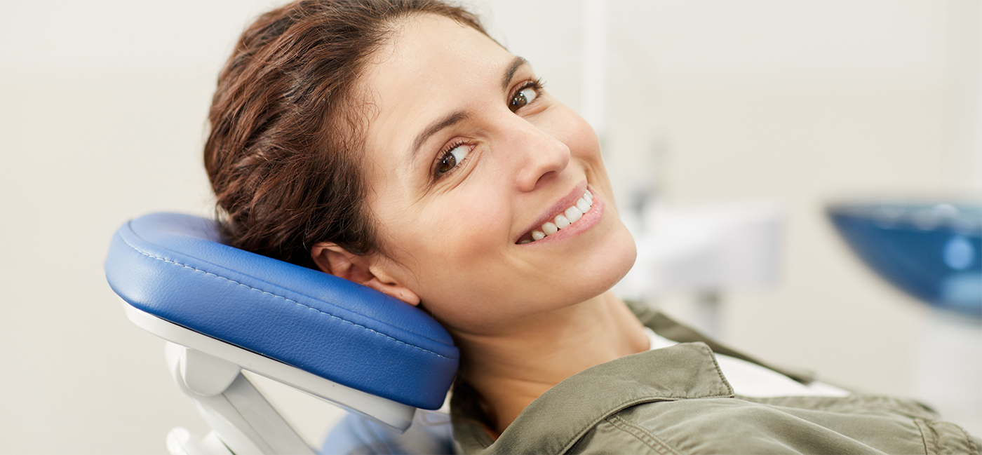 Close up of woman smiling in dental chair