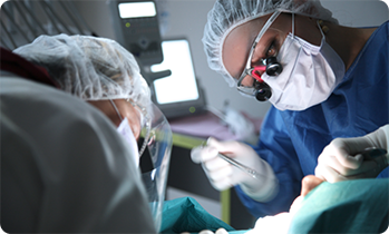 Two dentists performing a ridge expansion