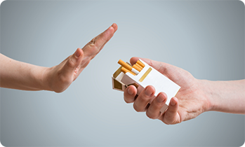 Hand refusing offer of cigarettes