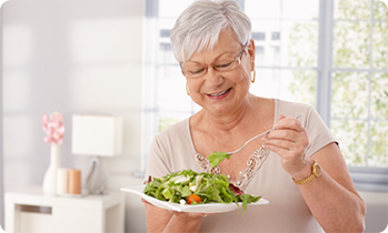 Senior woman eating a salad