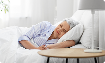 Senior woman sleeping in bed