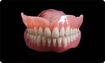 Full dentures on a black background