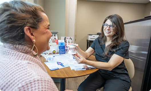 Female dentist talking to a patient