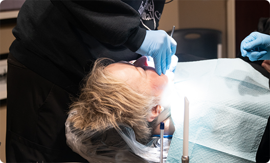 Relaxed dental patient having teeth treated