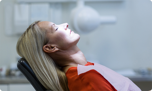 Female patient relaxed in dental chair