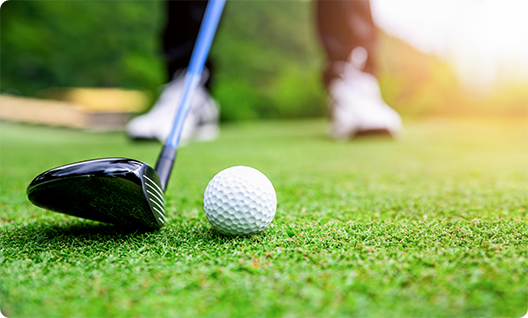 Close up of golf ball and golf club