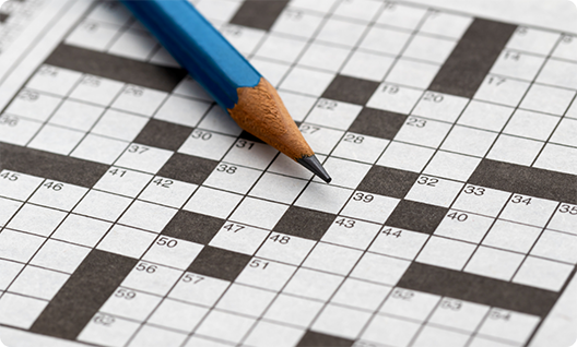 Pencil on top of a crossword puzzle