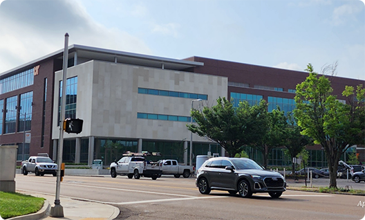 Cars in front of a university building