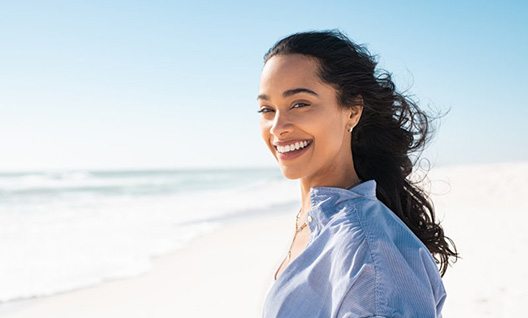 Lady smiles on beach