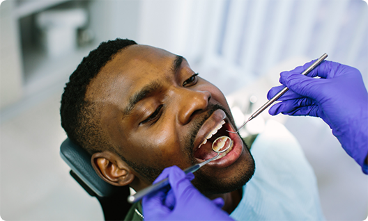 Male dental patient visiting dentist for preventive dentistry in Little Rock