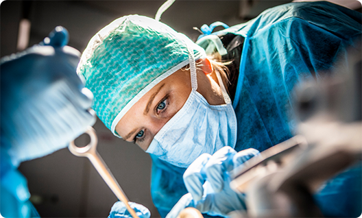 Dentist in mask performing a procedure