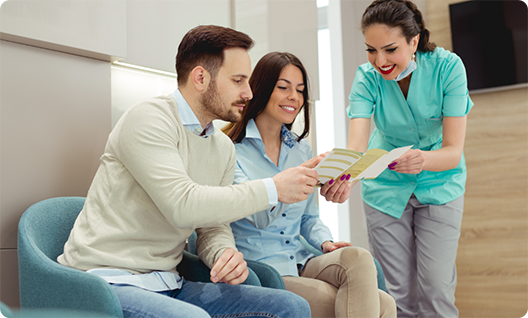 Dentist showing couple financial information